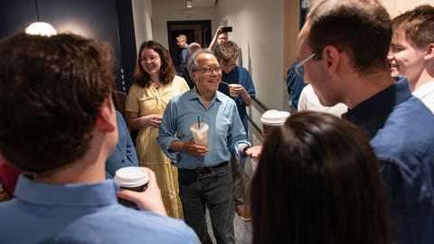 World-renowned cellist Yo-Yo Ma ’76 is greeted by members of the Harvard University Choir last May for a joint recording session. 