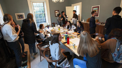 Students enjoy snacks and conversation at Sparks House for After School Snack