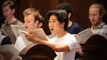 Choir members rehearse for Evensong in Appleton Chapel