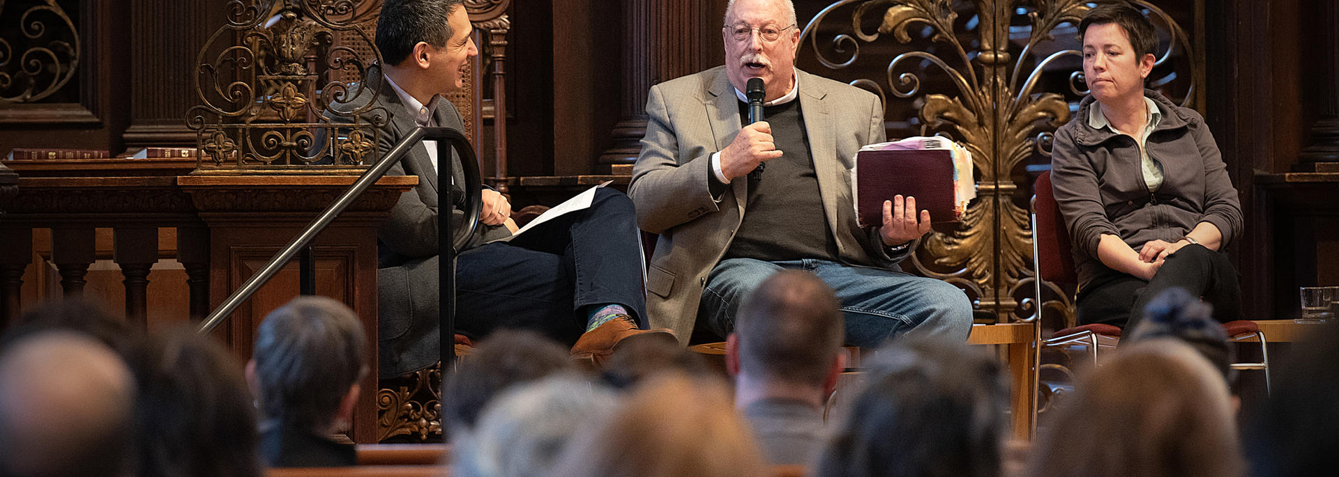 The Rev. Jim Mitulski, former pastor at the Metropolitan Community Church of San Francisco, speaks with the Rev. Matthew Ichihashi Potts (far left) and podcast creators Siri Colom, Lynne Gerber, and Ariana Nedelman, at the Noble Lecture on April 16. Photo by Jeffrey Blackwell.