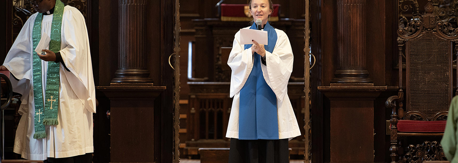 Amy Sexauer MDiv '26, leads the concluding prayer from the front of the Memorial Church. 