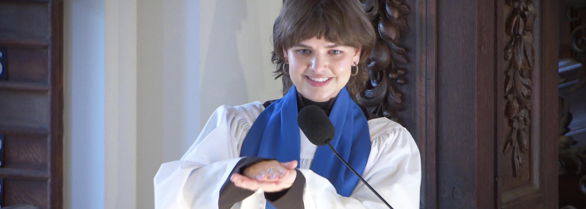 Elizabeth Propst preaches from a pulpit in the Memorial Church