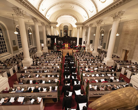 Harvard University Choir processes in the to sanctuary at the 115th Annual Christmas Carols Service