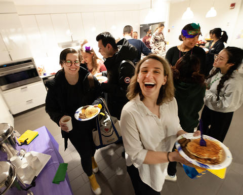 Students line up for the Mardi Gras Pancake Supper in the Student Oasis.