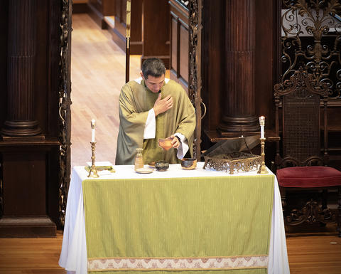 The Rev. Matthew Potts presides over Holy Communion Service