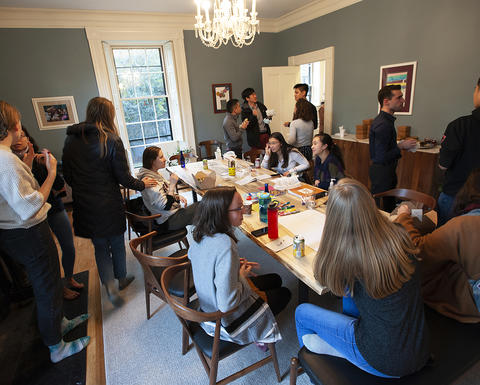 Students enjoy snacks and conversation at Sparks House for After School Snack