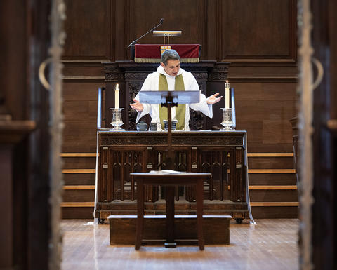 The Rev. Matthew Potts conducts Holy Communion in Appleton Chapel