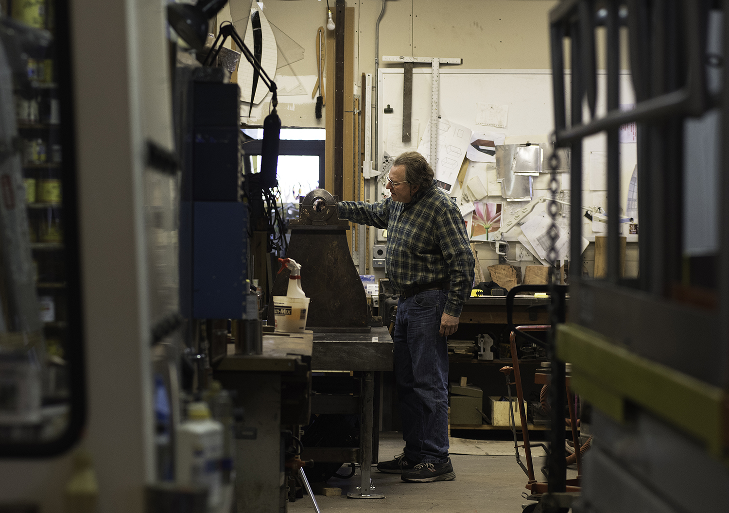 Boston Artist Gregory Curci works on the bell's bearing assembly