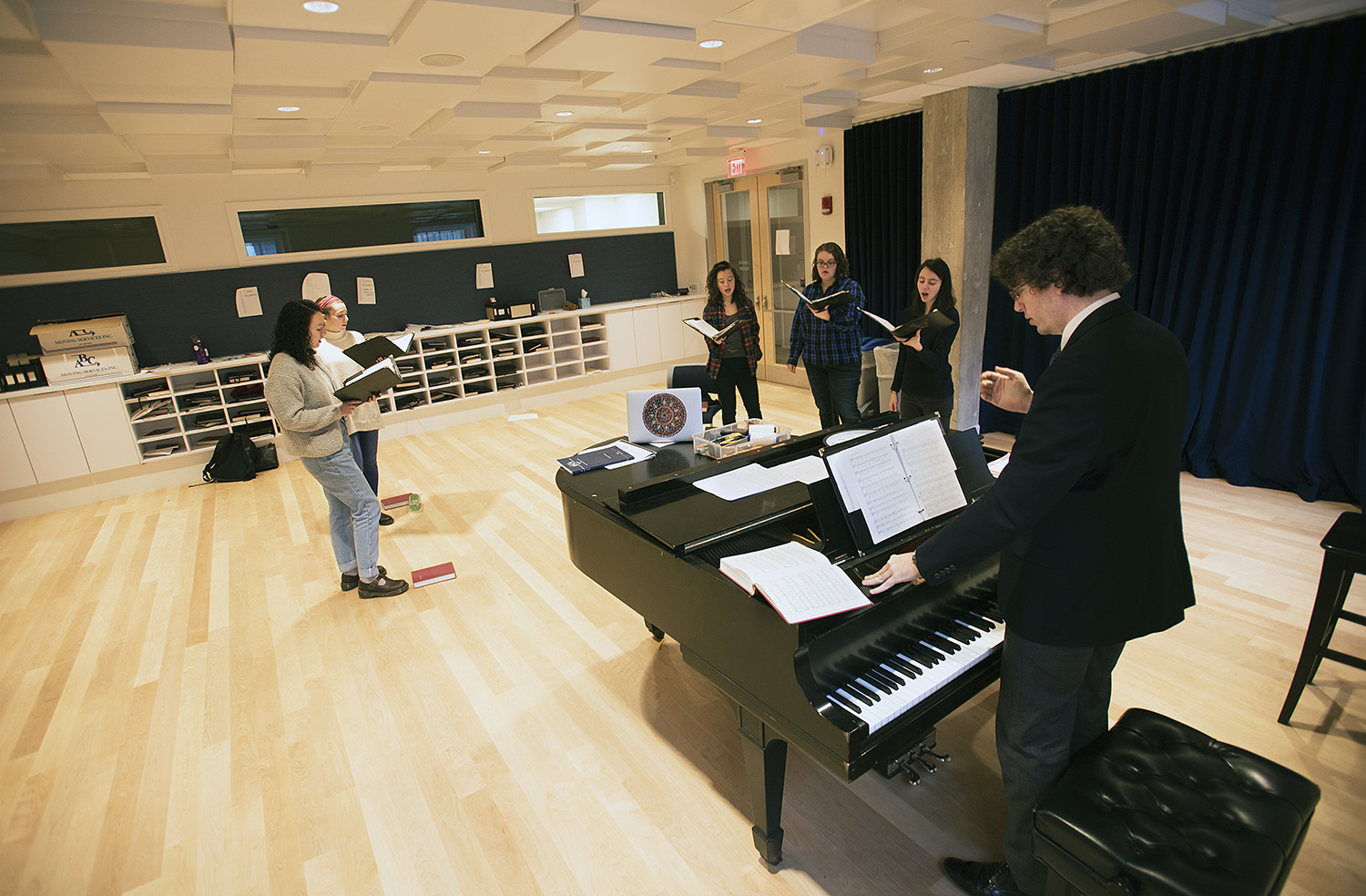 Members of Harvard University Choir rehearse in new choir room