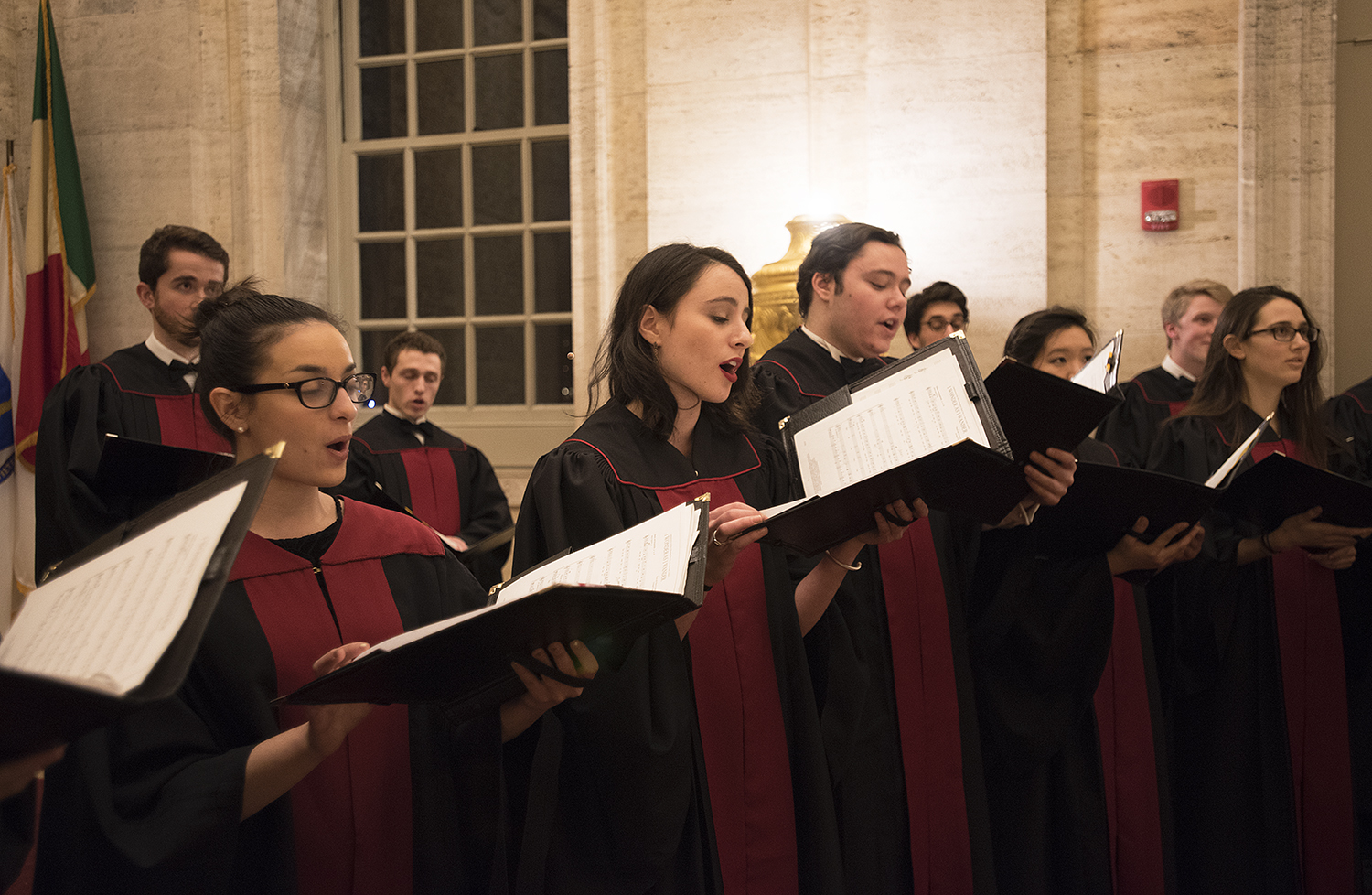 Cara Jacobson '18 (second from the left), a coral fellow and choir secretary, sings in the Memorial room of Memorial Church.