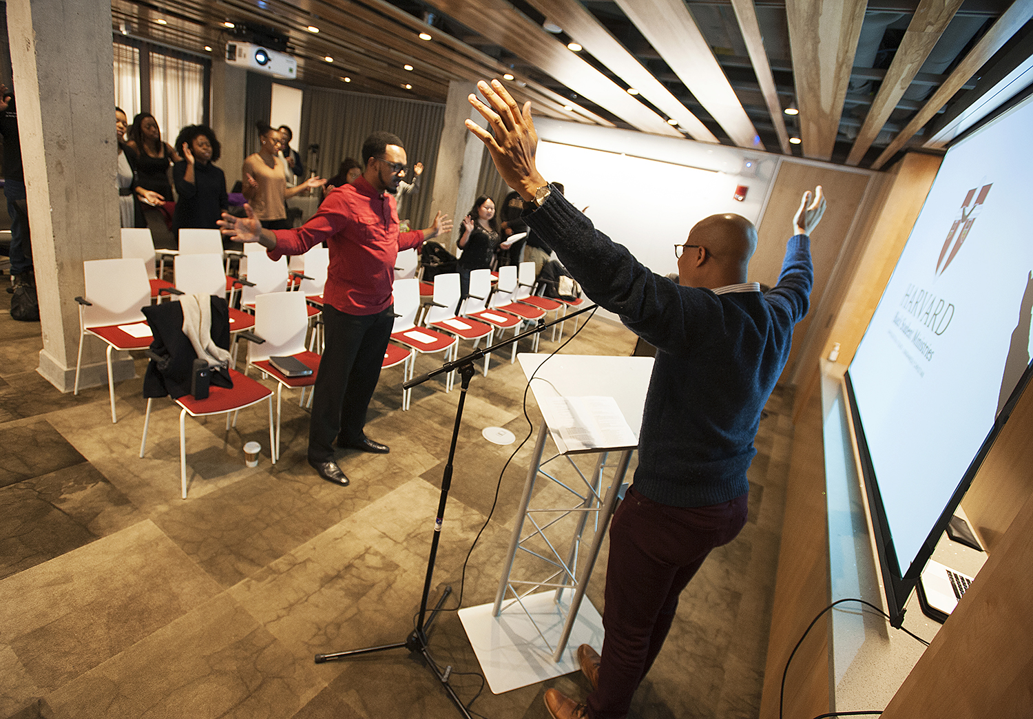 Harvard Business School student Lumumba Seegars leads members of the Havard Black Student Ministry in prayer