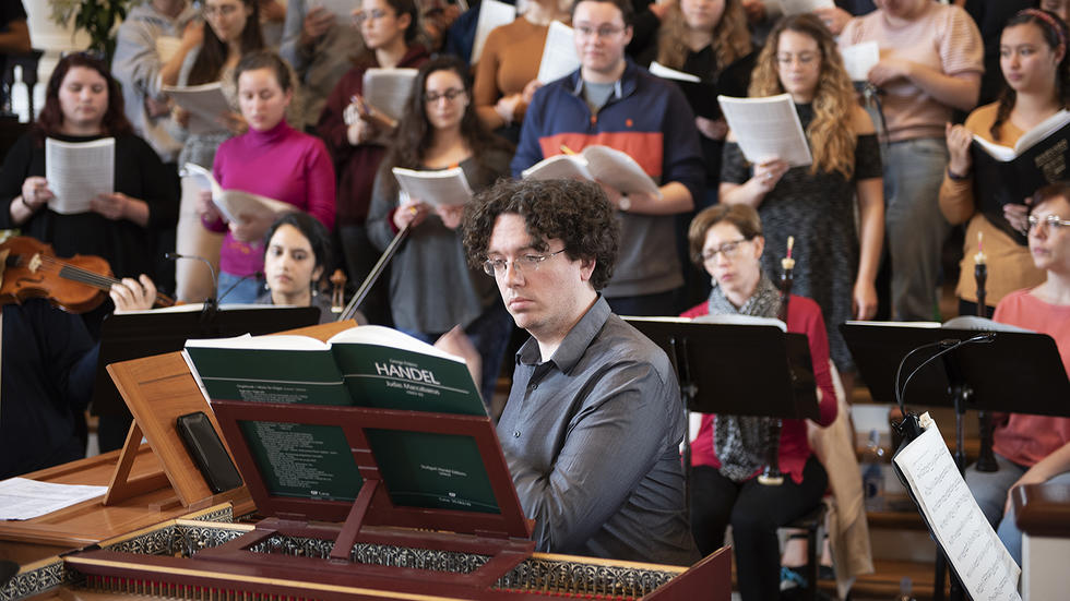 Thomas Sheehan plays the harpsichord in rehearsal Spring Concert