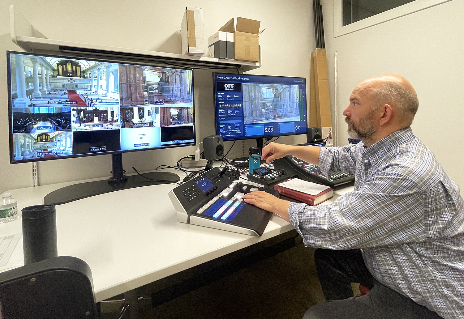 Jeff Valade, Senior Media Technician, Harvard Media Production Center, at the control center of the AV system