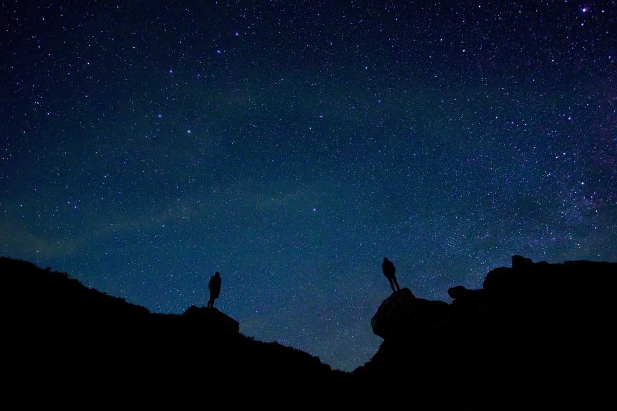 Image: two strangers against the night sky